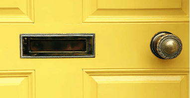 A front door with polished hardware